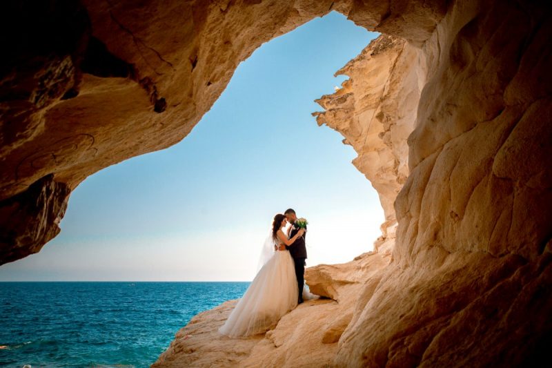 Bride and Groom Beside Sea.png