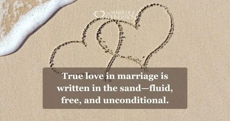 A heart drawn in sand represents the fluid, free nature of marital love.